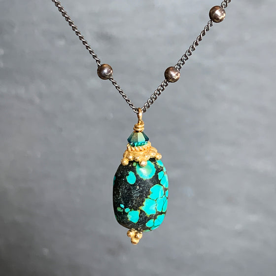 Genuine Turquoise Pebble with Gold Detail on an Oxidised Dotted Silver Chain Necklace